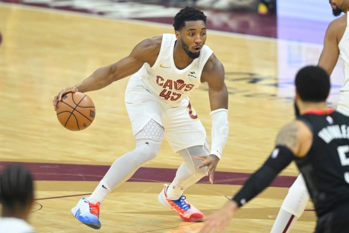 Dec 18, 2023; Cleveland, Ohio, USA; Cleveland Cavaliers guard Donovan Mitchell (45) dribbles the ball in the first quarter against the Houston Rockets at Rocket Mortgage FieldHouse.